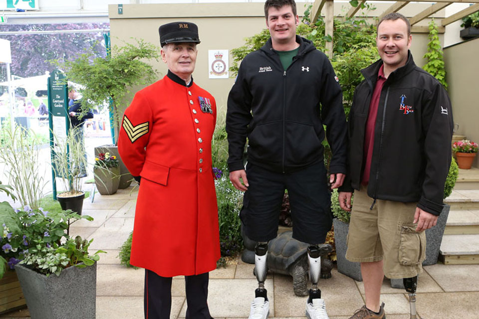 Captain David Henson (centre) and Sergeant Craig Gadd, a Royal Engineer from 23 Engineer Regiment, with Chelsea Pensioner Frank Melton at the debut of Headley Court's Courtyard Garden at the Chelsea Flower Show