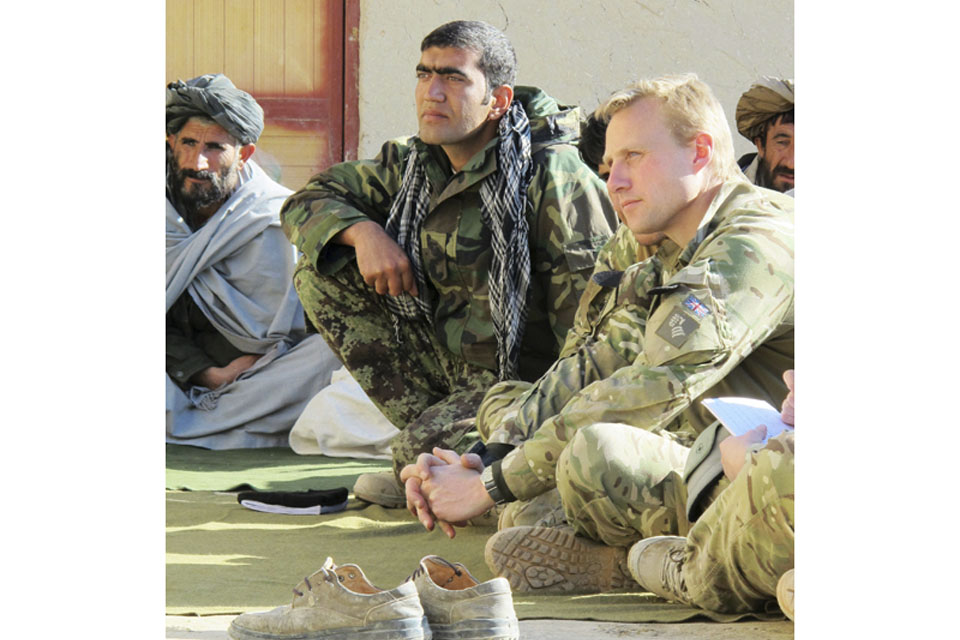 Lieutenant Jawid, Afghan National Army, and Major Ross Noott attend a shura at Khorgajat School