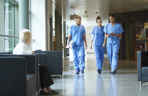 Doctors talking in hospital corridor