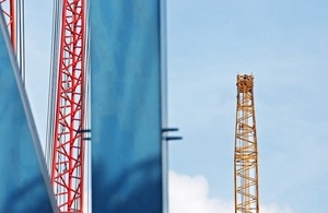 Cranes against sky