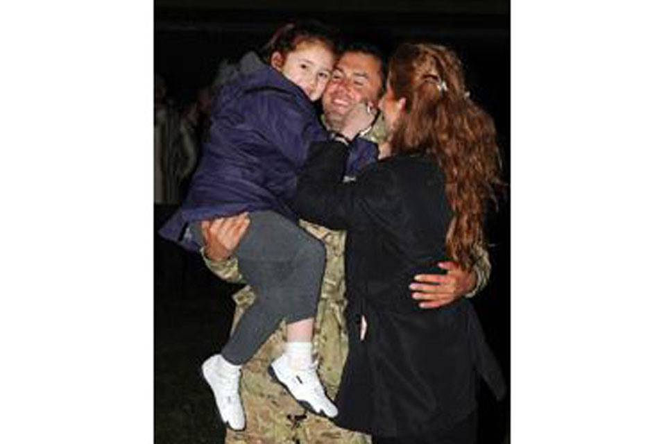 Jason Wozniak of 58 Squadron RAF Regiment reunites with his family 