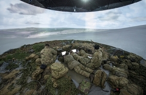 Soldiers inside a simulation tent.