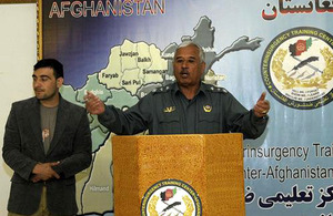 Major General Rouzi of the Afghan National Police talks to a group of more than 100 people at the first ISAF Joint Command counter-insurgency shura