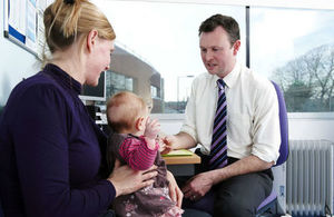 GP consulting a mother and her baby
