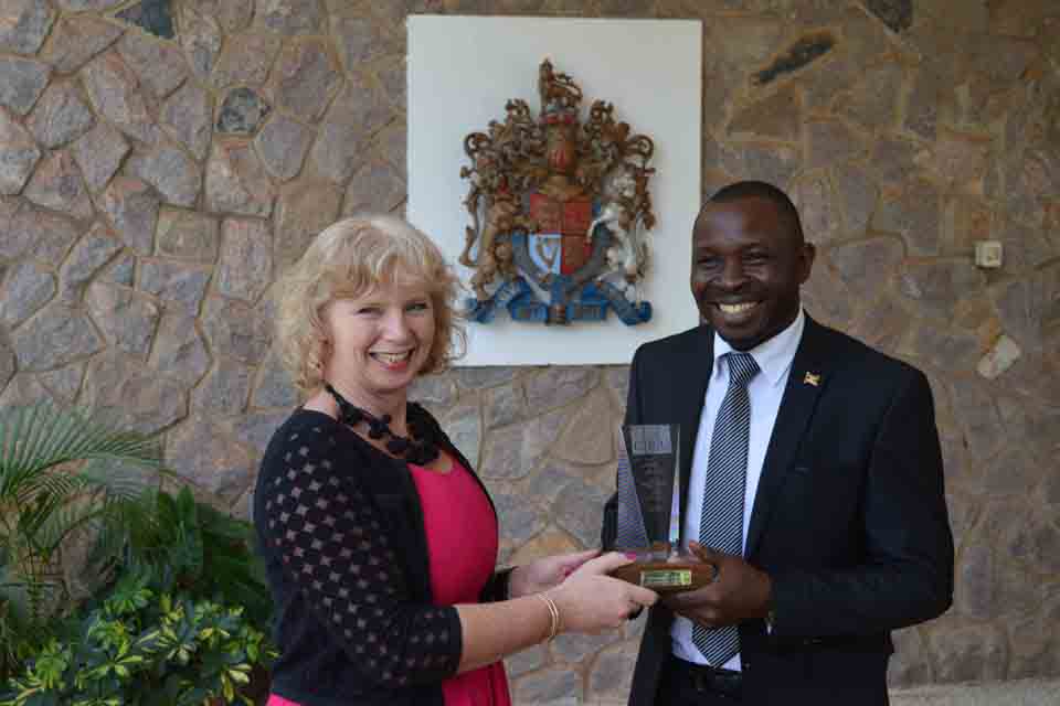 HE Alison Blackburne presents the prestigious Lord Astor Award to Robert Sempala.