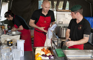 Celebrity chef Simon Rimmer and Sergeant Dale Riddel, an Instructor from the Defence Food Services School, preparing their offering in the battle of the dishes