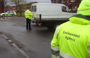 Image of police and Environment Agency officers on an operation