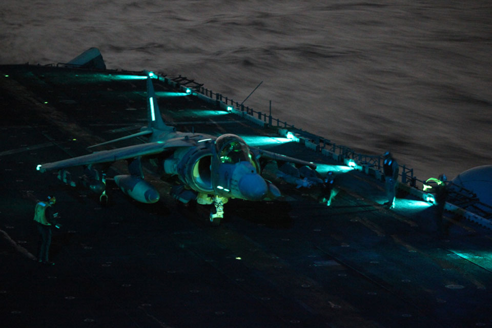 A United States Harrier jet, assigned to the 26th Marine Expeditionary Unit, returns to the amphibious assault ship USS Kearsarge in the Mediterranean for fuel and ammunition resupply following a strike mission over Libya 