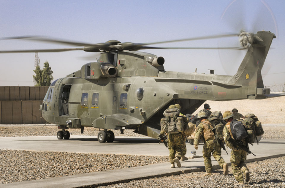 Troops embark on a Merlin helicopter at a patrol base in Afghanistan  