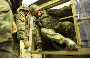 British soldiers using the Roll Over Drills Egress Trainer