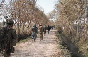 Members of 1st Battalion The Princess of Wales's Royal Regiment conduct a joint patrol with members of the Afghan National Security Forces in Helmand province, southern Afghanistan