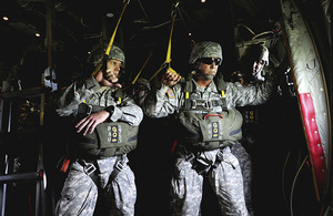 Members of the US Army's Civil Affairs and Psychological Operations Command (Airborne) ready to jump from a British Hercules C-130 over Salisbury Plain