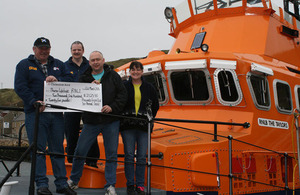 PC Shewell and RNLI crew with The Taylors lifeboat