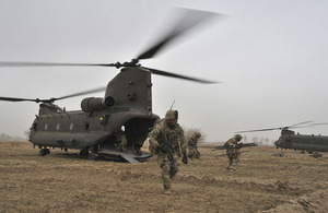 British soldiers from the Queen's Royal Hussars Battle Group disembark a Chinook helicopter during Operation ZMARAY IBDA
