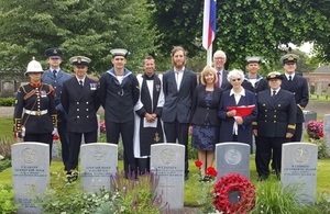 AB Dobson’s niece Joan Loftus holding the Union Flag whilst accompanied by family members and representatives from Ship's Company. Crown Copyright. All rights reserved.