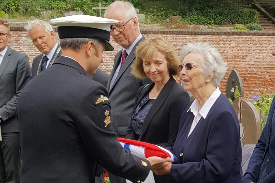 AB Dobson’s niece Joan Loftus receiving the Union Flag. Crown Copyright. All rights reserved.