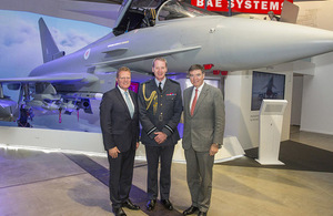 Minister for Defence Procurement, Philip Dunne, BAe Group Managing Director Nigel Whitehead and Air Vice Marshal Julian Young CB OBE front of a Typhoon model.