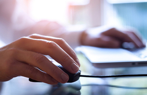 Hand on a computer mouse