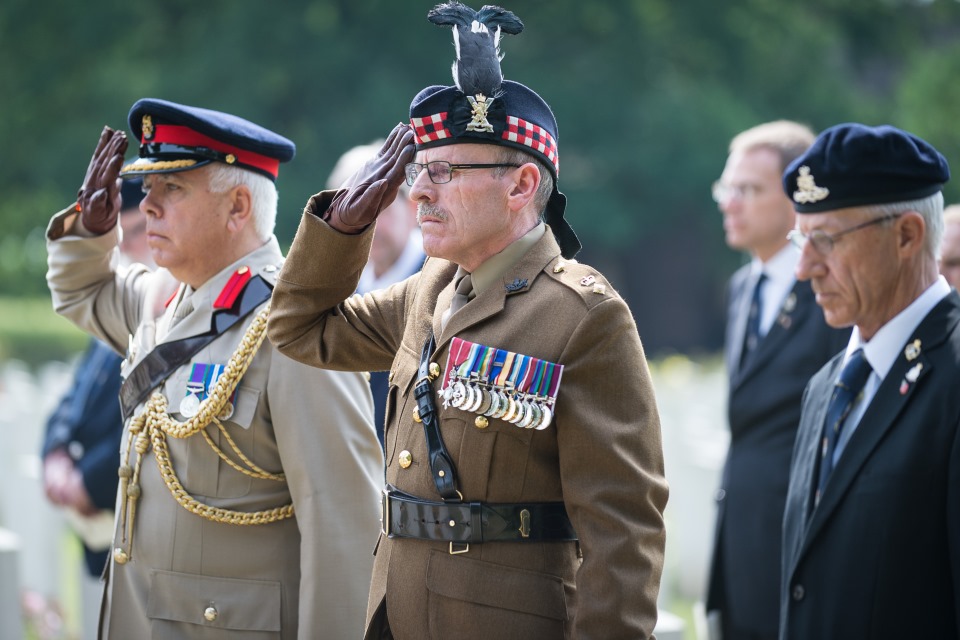 Army officials pay their respects to Major Wadeson and Lieutenant Mackenzie (Crown Copyright). All rights reserved.