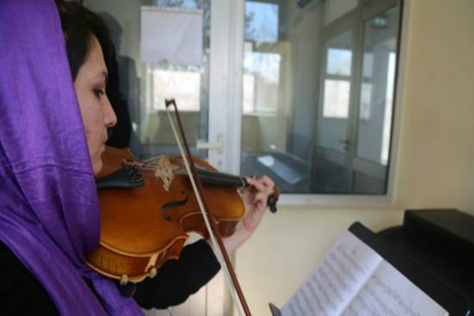 Afghan girl playing violin at ANIM