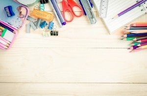 selection of stationery on light wood table