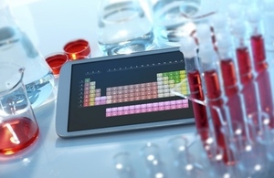 Digital tablet with lab equipment.