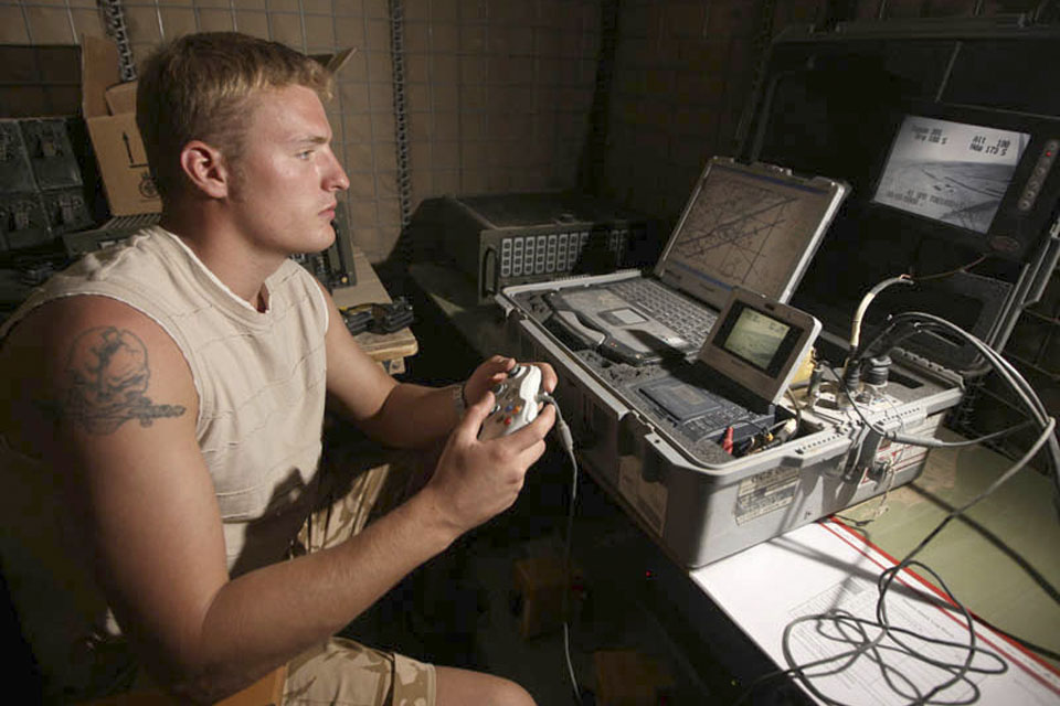 A soldier at the controls of a Desert Hawk (stock image)