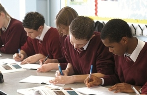 Secondary school pupils writing