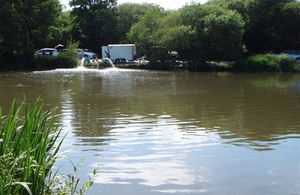 Environment Agency staff working to boost dissolved oxygen levels in the Par duck pond