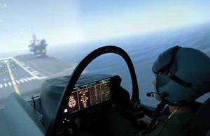 A pilot approaches the deck of one of the Queen Elizabeth Class aircraft carriers using the BAE Systems simulator at Warton