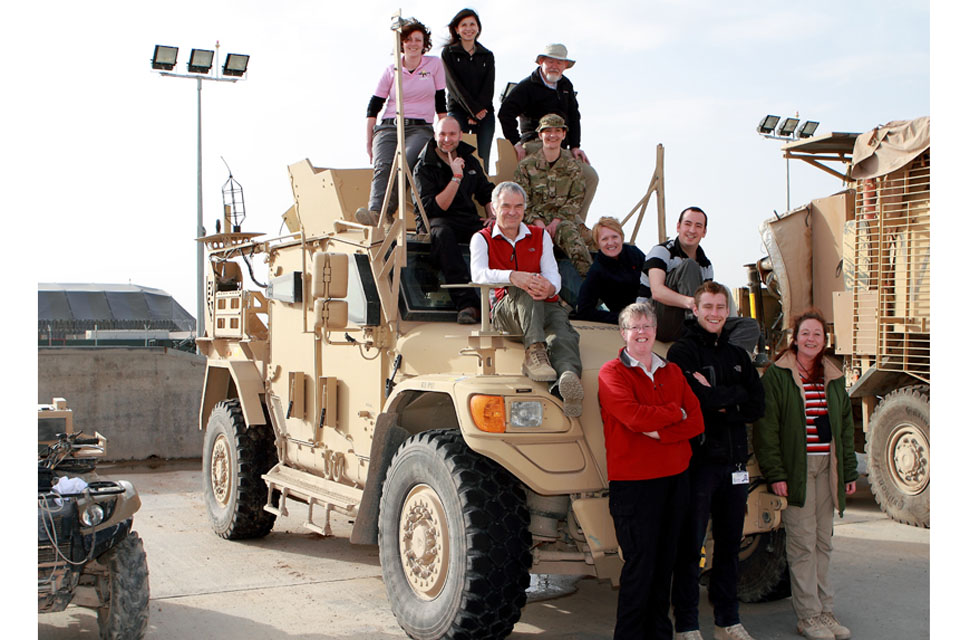 MOD civilians on Husky armoured vehicle at Camp Bastion