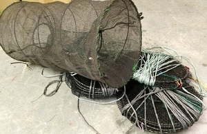 Image shows the four crayfish traps which were recovered from the river