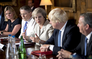 Prime Minister Theresa May, seated alongside Cabinet ministers, speaking in her Cabinet meeting at Chequers.