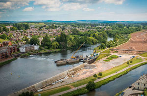 Aerial shot of tidal defence walls being built along the River Exe in Exeter