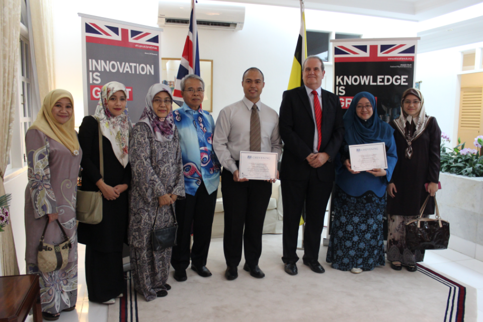 British High Commissioner David Campbell with Azizul and Khairunnisa and their families