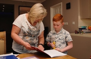Adult helping child with homework