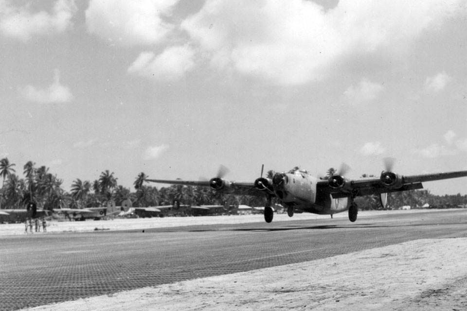 A Consolidated Liberator B Mark VI of 356 Squadron landing on three engines at Brown's West Island in the Cocos Islands after completing a sortie on 6 August 1945