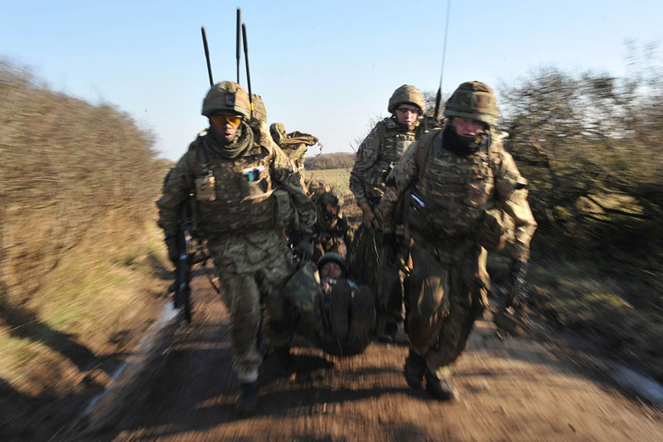 British soldiers carrying a simulated casualty during an exercise in Wales (stock image)