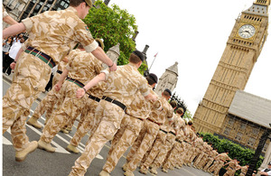 Members of 11 Light Brigade march into the grounds of the Palace of Westminster
