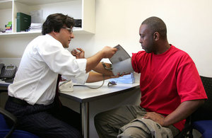 A person having their blood pressure measured.