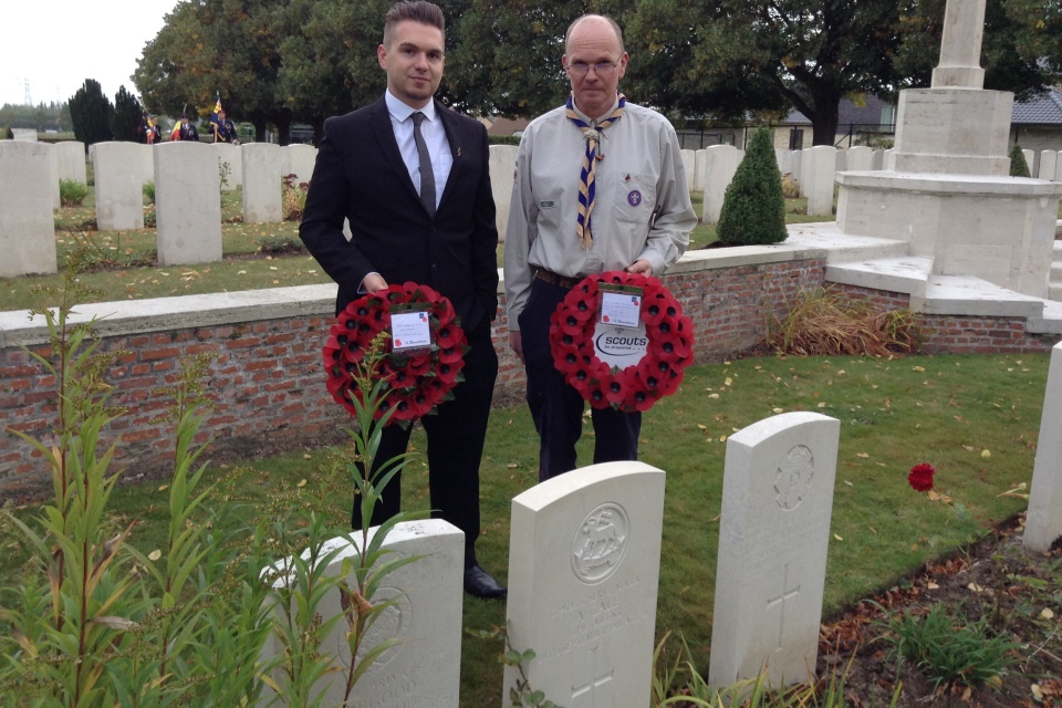 (left to right): Guy Boxall (son of Gary Boxall) and Gary Boxall great grandson of CSM Gale hold poppy wreaths by the headstone - Crown Copyright - All rights reserved