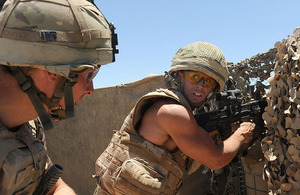 Corporal Mike Hansbury (right) and his colleague take up a defensive position