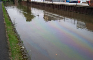 Visible oil slick on the canal