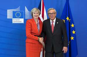 Prime Minister Theresa May shaking hands with European Commission President Jean-Claude Juncker.