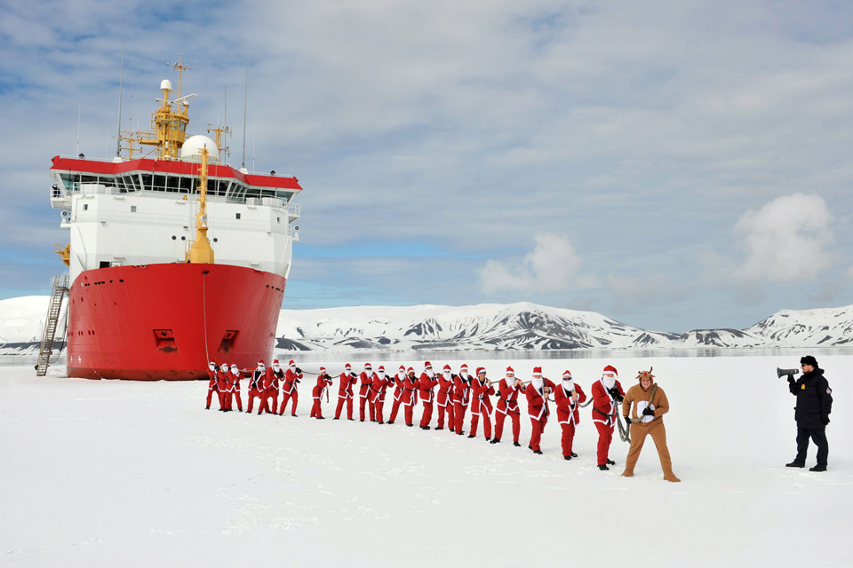 HMS Protector's Father Christmasses on the start line