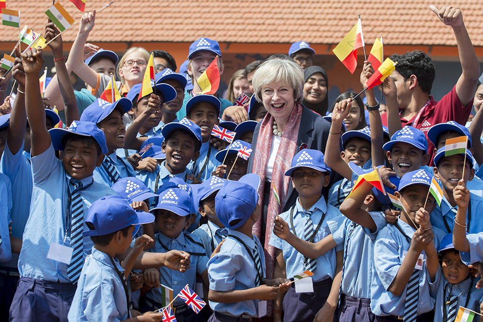 Prime Minister with school children at Stonehill School watching a military flypast.