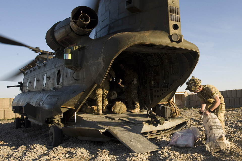 Royal Mail bags containing Christmas parcels being dropped off at a Patrol base in Helmand Province