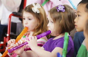 Primary school children playing recorders