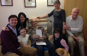 Top (L-R): Mr Juny's grandson Marek and his wife Tricia, Mr Juny (seated), daughter Kasia and son-in-law Chris. Bottom (L-R): Mr Juny's great-grandchildren Maisie and Finlay [Picture: via MOD]