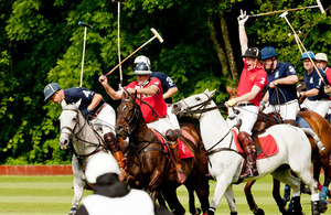 His Royal Highness Prince Harry, wearing the No 2 shirt, in the thick of the match [Picture: Graham Harrison, Crown Copyright/MOD 2011]